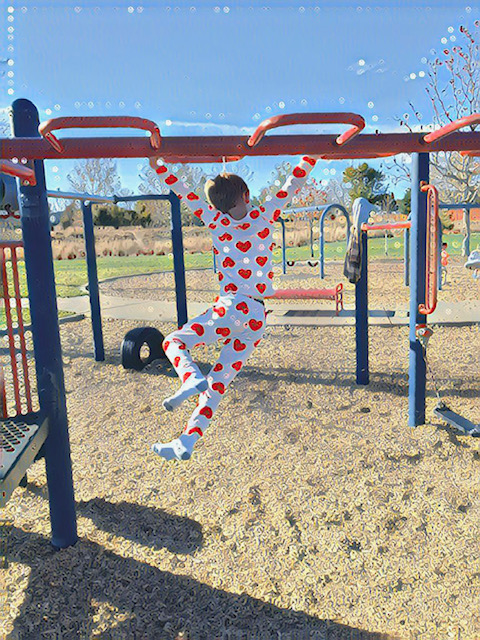 Boy on monkey bars, having the time of his life. "The Anxious Generation" champions the importance of play.