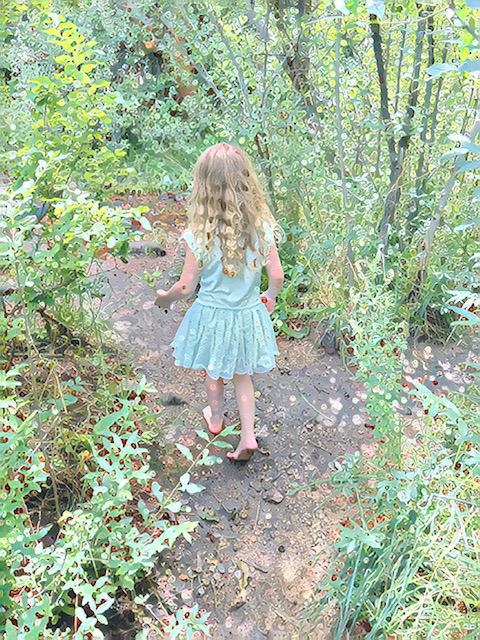 Girl walking through the woods, making memories! Get out! You'll make more memories too. Try spending 1000 Hours Outside per year!